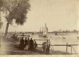 Sevilla, Muelle desde los Remedios, Guadalquivir y Torre del Oro, con personajes y pareja bailando. E. Beauchy.